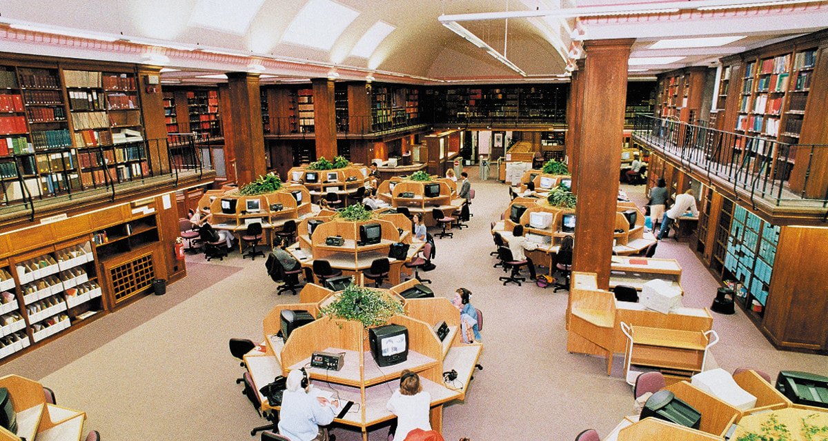 Interior view of Newcastle University Library with students studying."