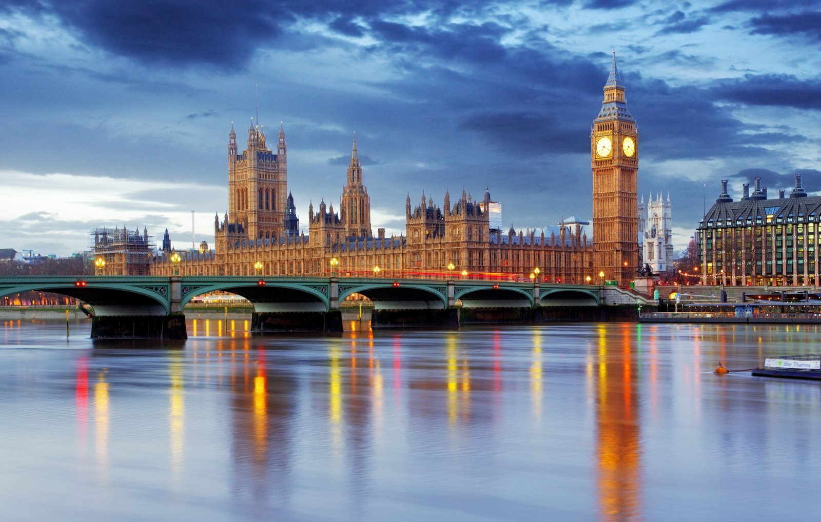 London Bridge spanning the River Thames with nearby student housing visible along the riverbank