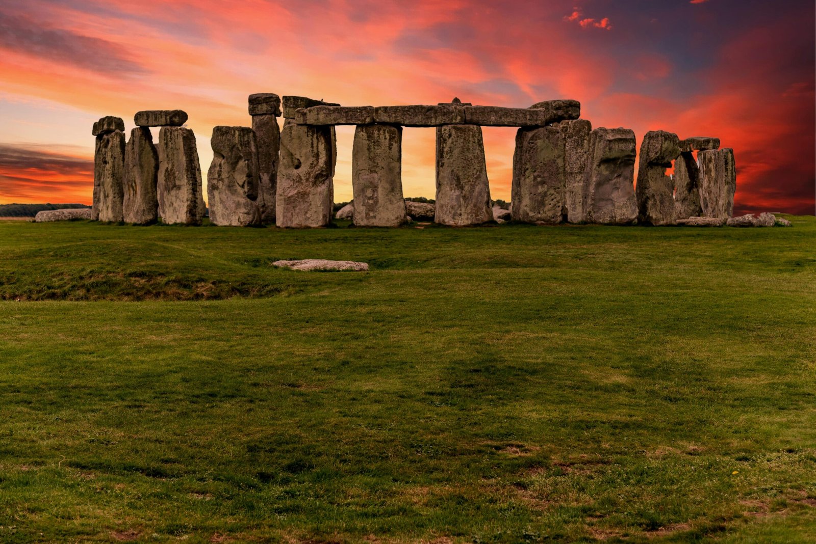 "Stonehenge ancient stone circle in Wiltshire, England, with student housing in the background."