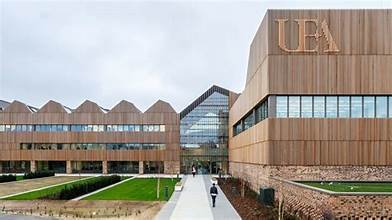 University of East Anglia's modern buildings set against a vibrant Norwich cityscape in the United Kingdom.